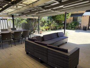 Entertainment area at back of home Outdoor entertainment leisure seating space at Harcourt West
